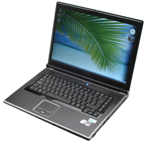 Rock Xtreme 620 gaming laptop with palm tree wallpaper on screen.