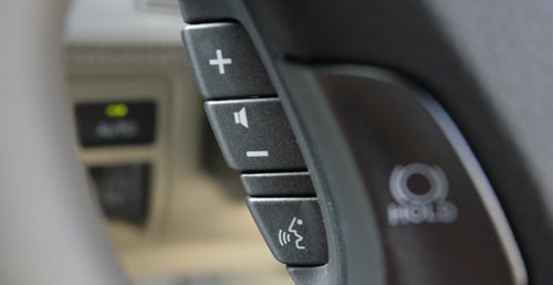 Close-up of Lexus LS600h L steering wheel controls.