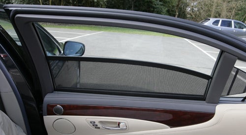 Lexus LS600h L's rear door with sunshade and luxury trim.