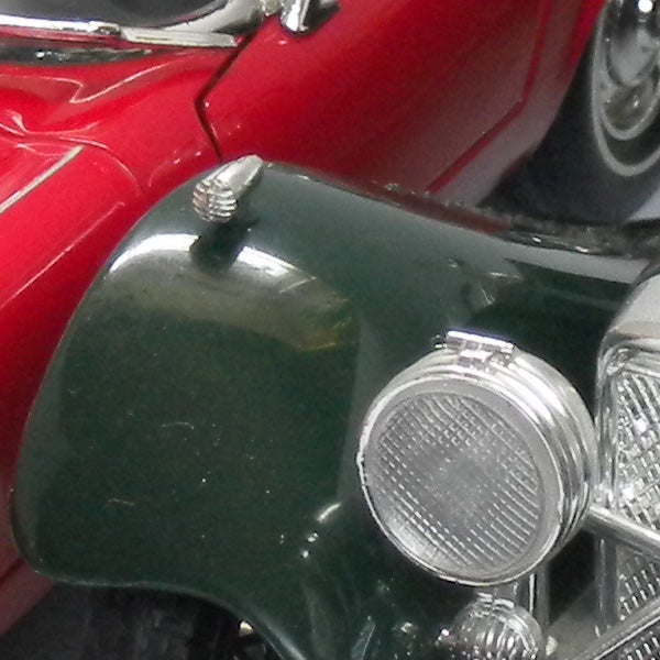 Close-up of vintage cars showing detail and color contrast.
