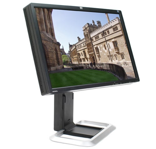 HP LP2475w 24-inch H-IPS LCD monitor displaying colorful architecture image.