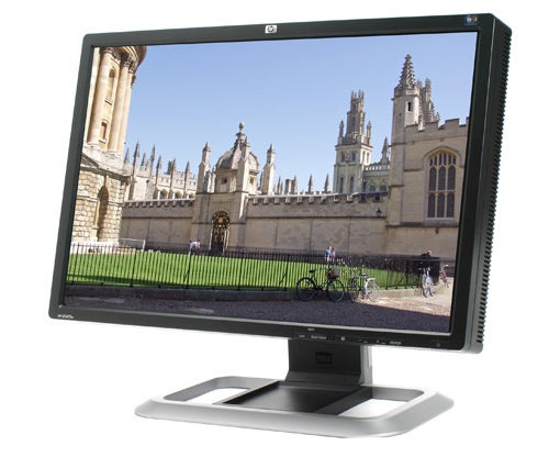 HP LP2475w 24-inch H-IPS LCD monitor displaying a landscape image.