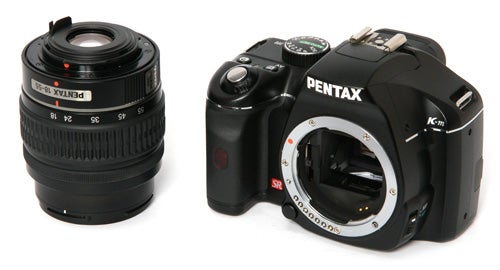 Pentax K-m DSLR camera with detachable lens.