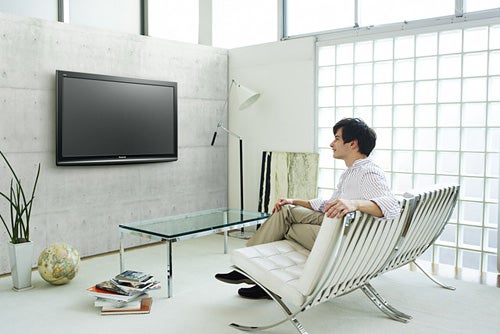 Man watching Panasonic Viera 46-inch Plasma TV in modern room