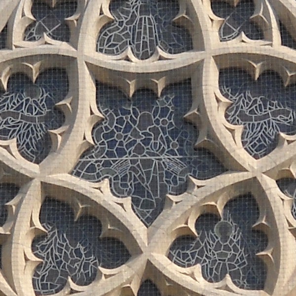 Close-up of intricate stone lattice work design.