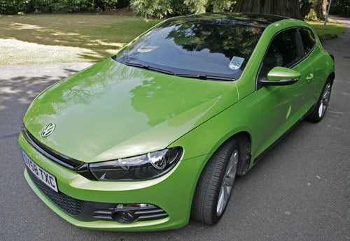 Green Volkswagen Scirocco GT 2.0l TSi parked outdoors