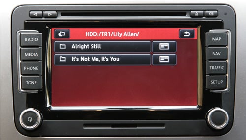 Volkswagen Scirocco GT infotainment system display showing music tracks.