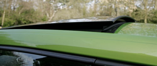 Close-up of Volkswagen Scirocco GT green roof and spoiler.