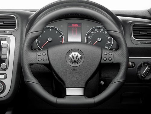 Volkswagen Scirocco GT steering wheel and dashboard view.
