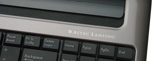 Close-up of Asus N50Vc notebook keyboard and speaker branding.