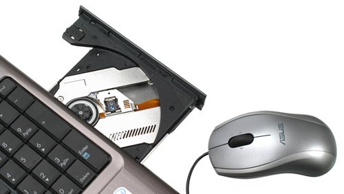 Asus N50Vc notebook with open Blu-ray drive and external mouse.
