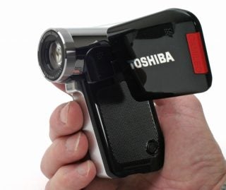 Hand holding Toshiba Camileo P30 camcorder.