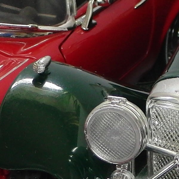 Close-up of vintage red and green model cars