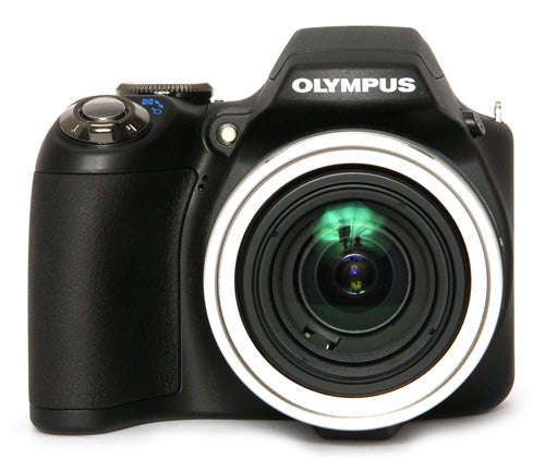 Olympus SP-590UZ camera with zoom lens on white background.