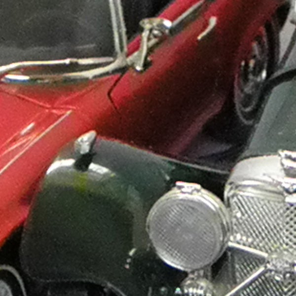 Close-up of classic red and silver model cars