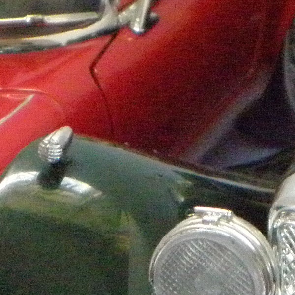 close-up of vintage cars through camera lens.