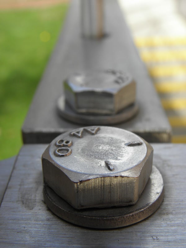 Close-up of metallic bolts with shallow depth of field.