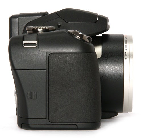 Olympus SP-590UZ camera on a white background.
