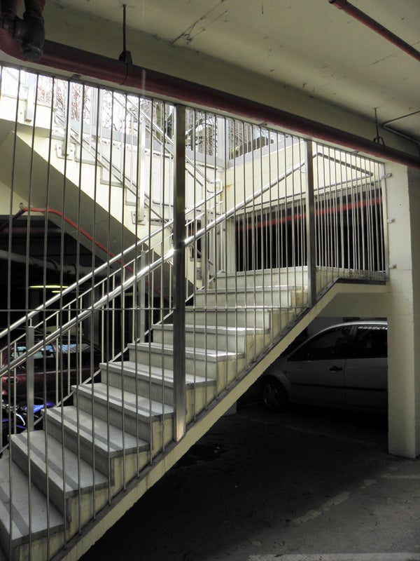 Photo taken with Olympus SP-590UZ showing a stairway in a parking garage.