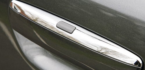 Close-up of Audi A8's door handle detail.