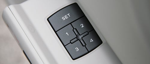Close-up of Audi A8 seat memory buttons on door panel.