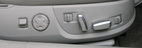 Close-up of Audi A8 seat memory buttons on door panel.Audi A8 seat adjustment controls detail.