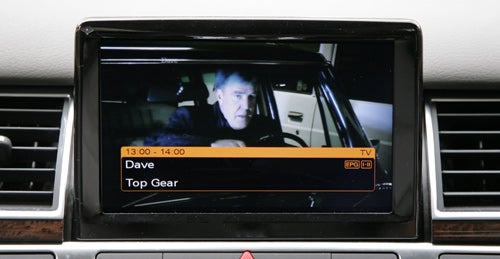 Infotainment screen in Audi A8 showing a TV show.