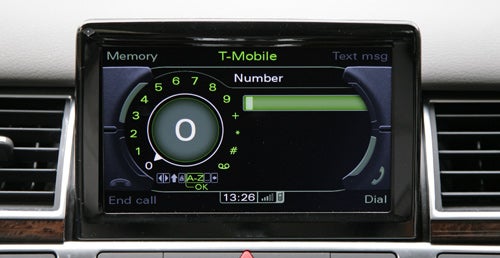 In-car telephone interface of Audi A8 with T-Mobile connection displayed.