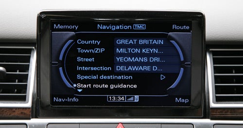 Audi A8 navigation system interface displaying menu options.