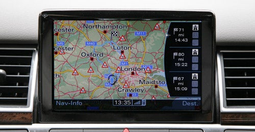 Audi A8 navigation system displaying a map with traffic updates.