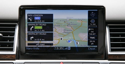 Audi A8 navigation system interface displaying map and route information.Audi A8 navigation screen displaying route and traffic information.