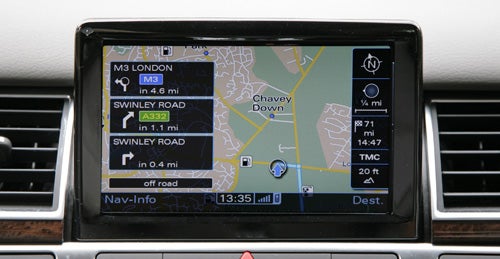 Audi A8 navigation system interface displaying map and route information.