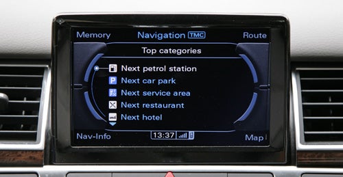 Audi A8 navigation system screen showing nearby services options.