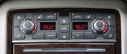 Audi A8 climate control panel set to 19°C and 18°C.Audi A8 climate control interface showing temperature settings.