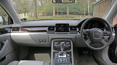 Interior view of Audi A8 2.8 Sport Multitronic dashboard and console.
