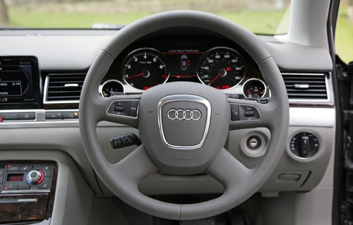 Interior view of Audi A8 2.8 Sport Multitronic steering wheel and dashboard.