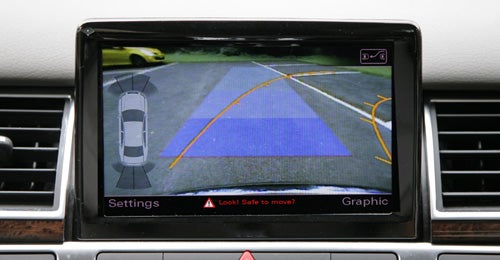 Audi A8 backup camera display with parking assist lines.