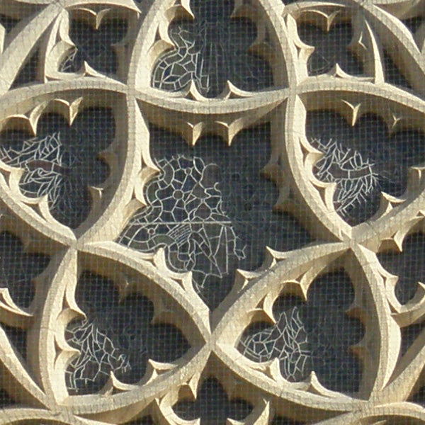 Ornate stone window tracery with intricate patterns