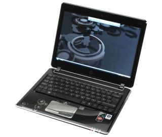 HP Pavilion dv2-1030ea notebook open on desk displaying screen