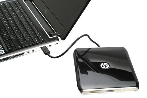 HP Pavilion dv2-1030ea notebook connected to an external optical drive.
