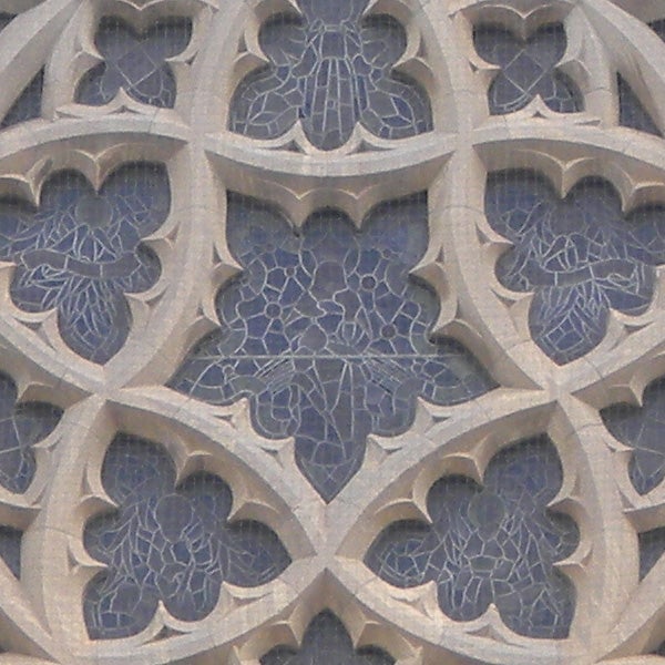 Close-up of intricate stone filigree architecture.