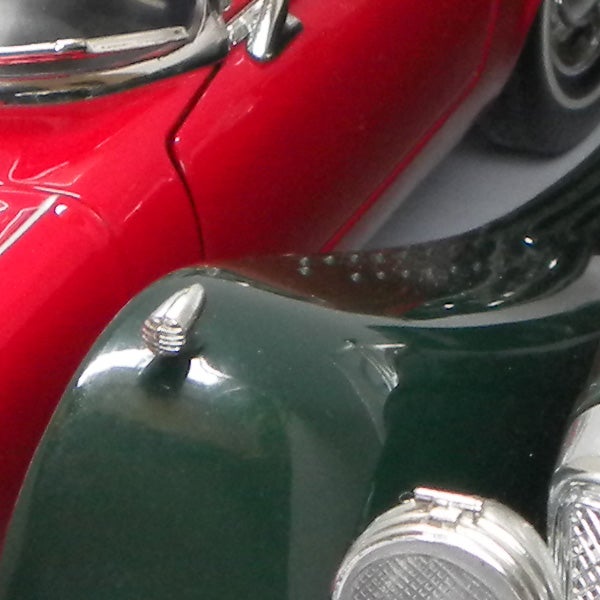 Close-up of colorful vintage car models.