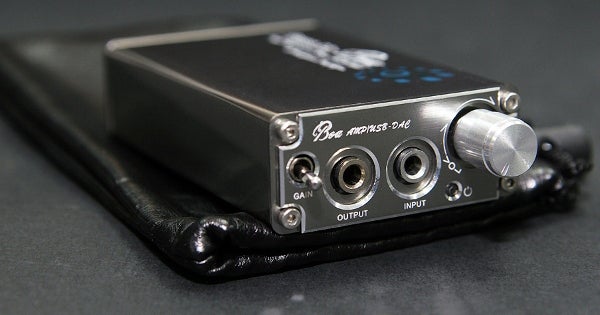 iBasso D2 Boa headphone amplifier on black surface.
