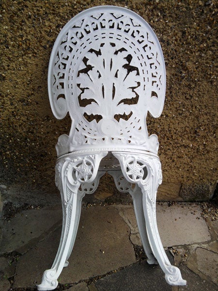 Intricately designed white Victorian-style chair.