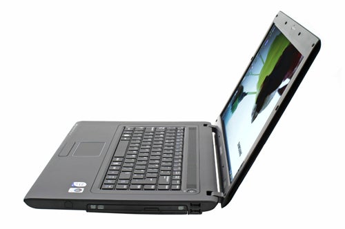 Samsung R522 notebook with screen on, side angle view.