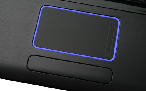 Close-up of Samsung R522 notebook touchpad with blue backlight