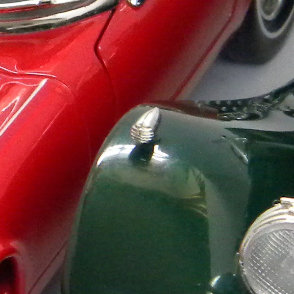 Close-up of vintage red and green toy cars photographed with Nikon Coolpix L100.