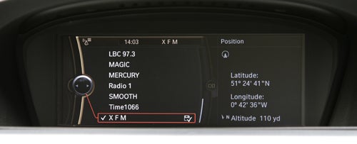 BMW 330d ConnectedDrive infotainment screen displaying GPS coordinates.