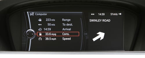 BMW 330d M Sport ConnectedDrive dashboard display showing navigation and fuel efficiency.