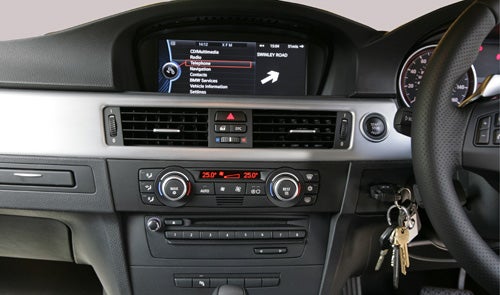 BMW 330d M Sport dashboard with ConnectedDrive system displayed.